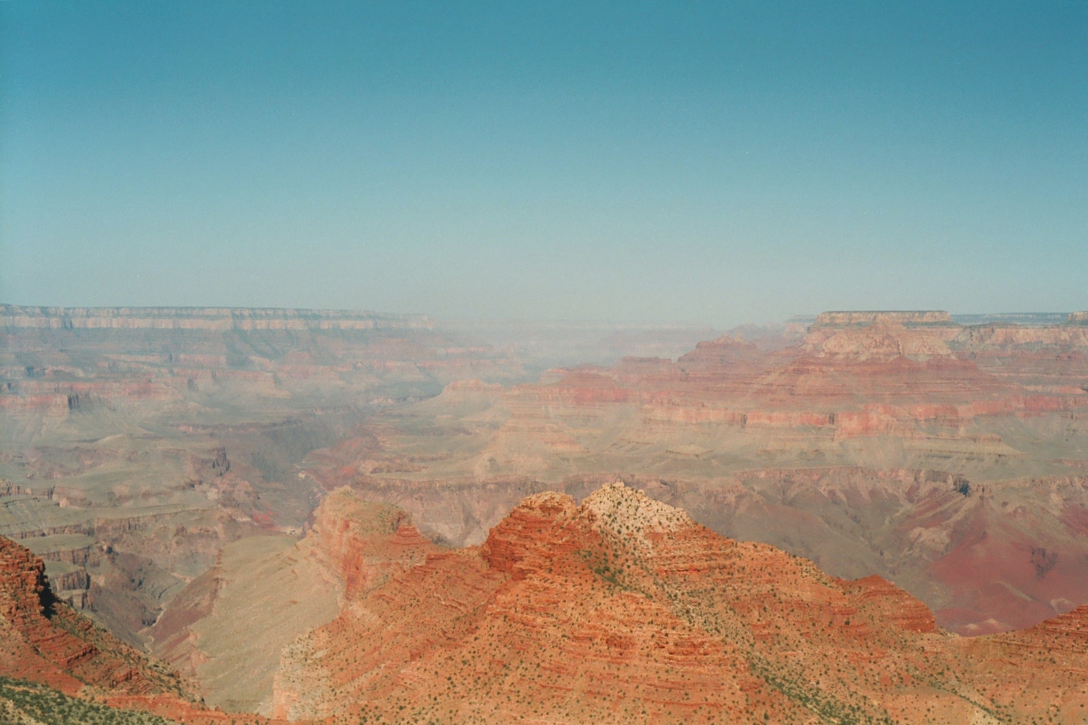 A wide expanse of the Canyon’s red rocks, looking like somewhere on Mars.