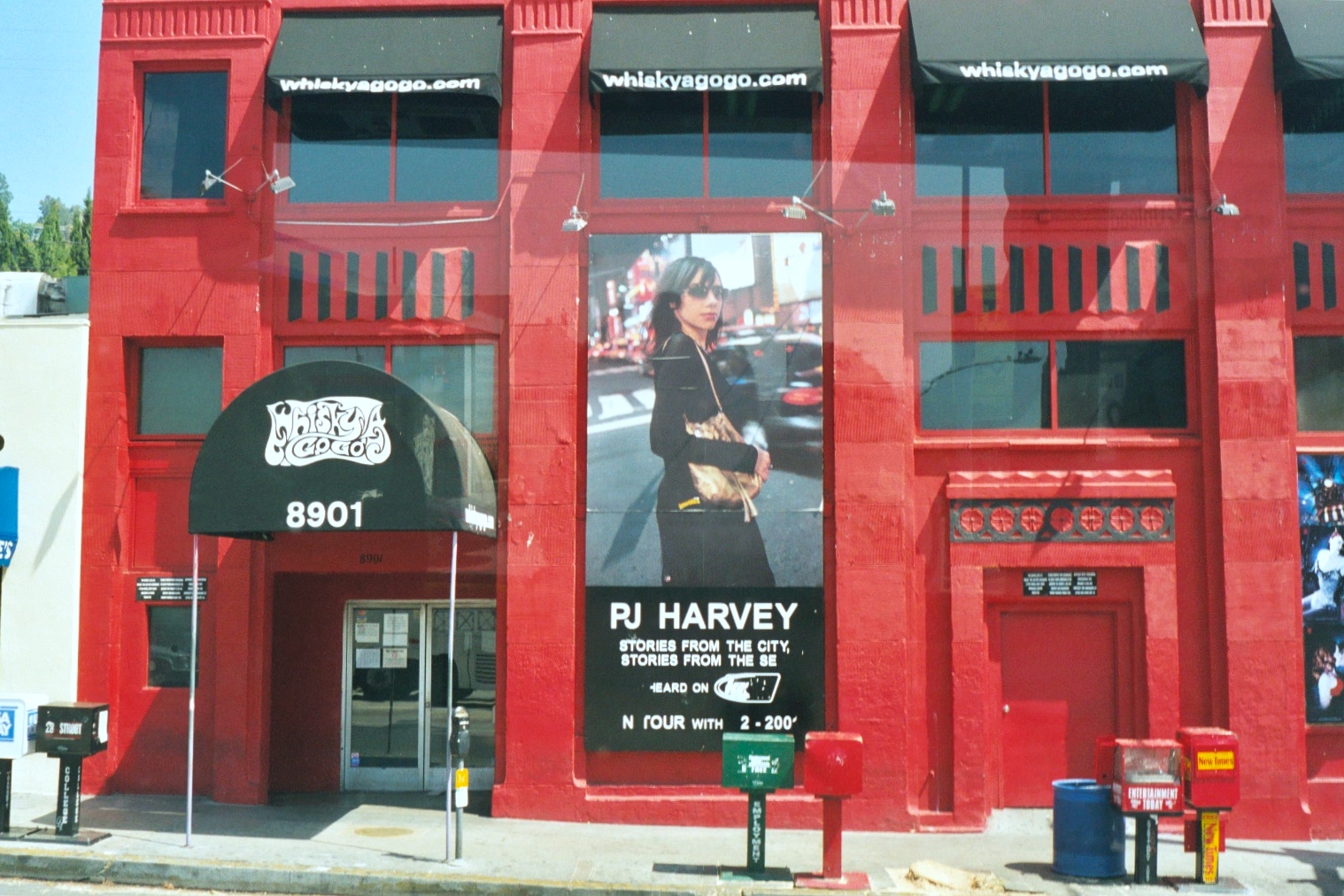 The bright red fascia of the Whiskey A-Go-Go in Los Angeles, with a huge PJ Harvey poster.